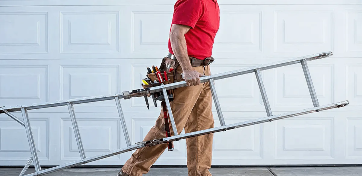 Garage door repair technician arriving with tools and ladder in Los Angeles, CA